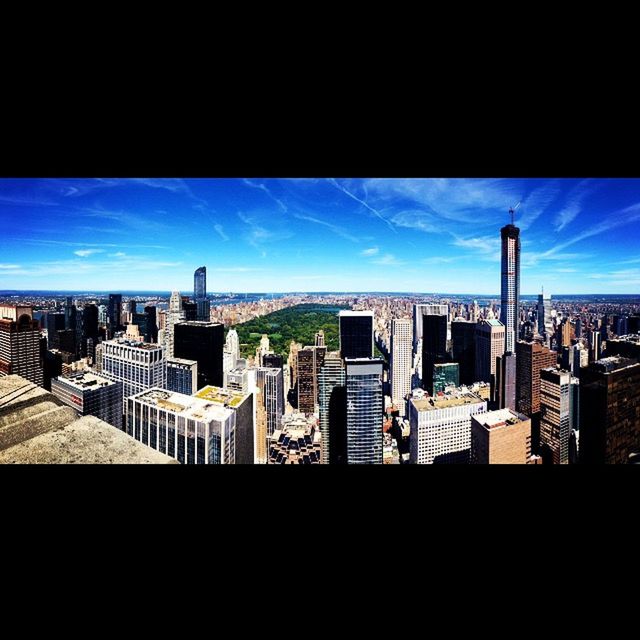 VIEW OF CITYSCAPE AGAINST BLUE SKY