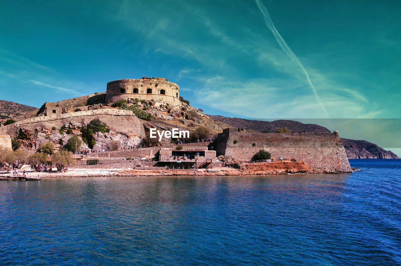 Crete, greece wide angle view of spinalonga unhabited island with a 16th century venetian fortress