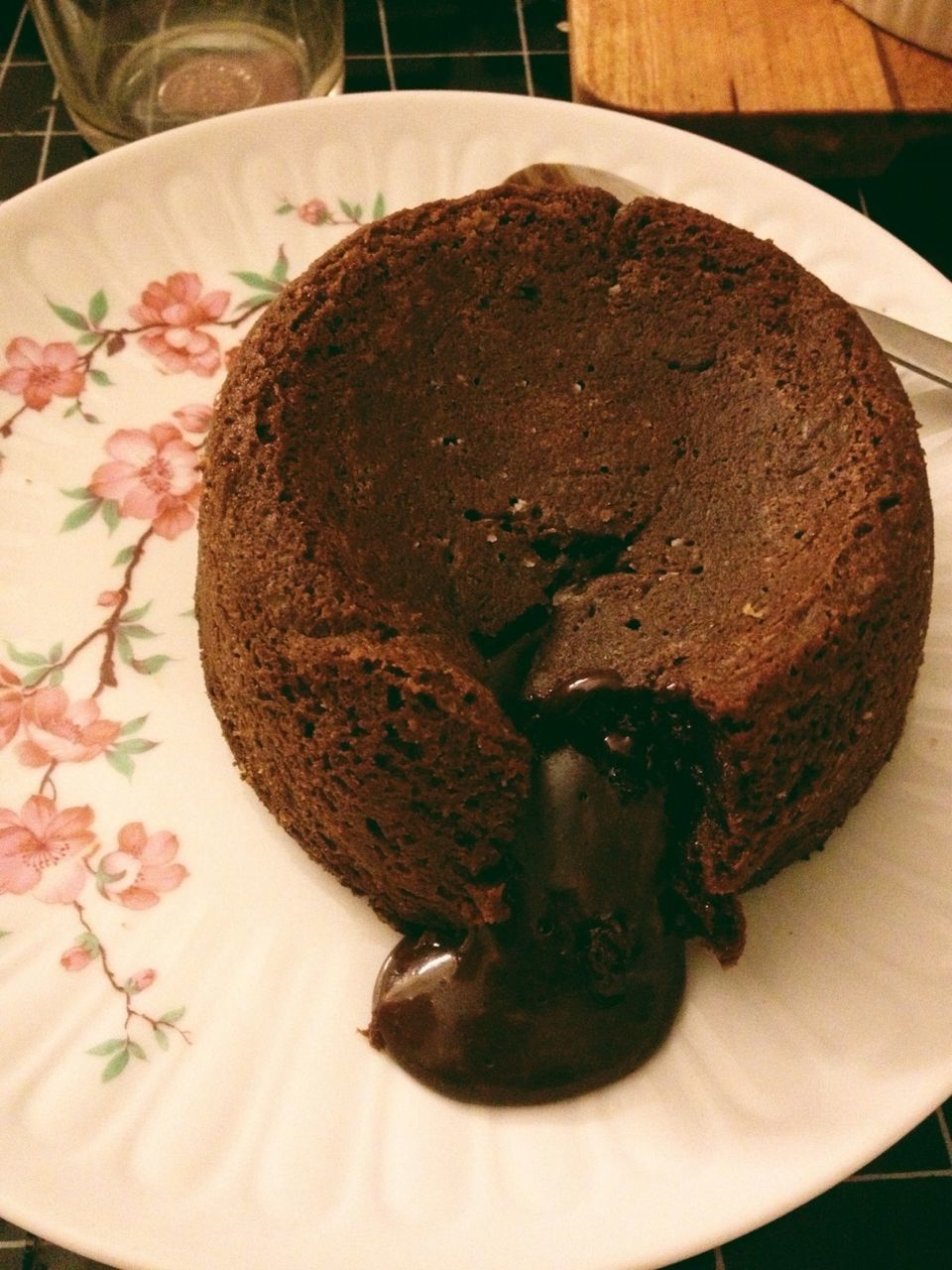 Close-up of mini chocolate cake with warm chocolate fudge sauce