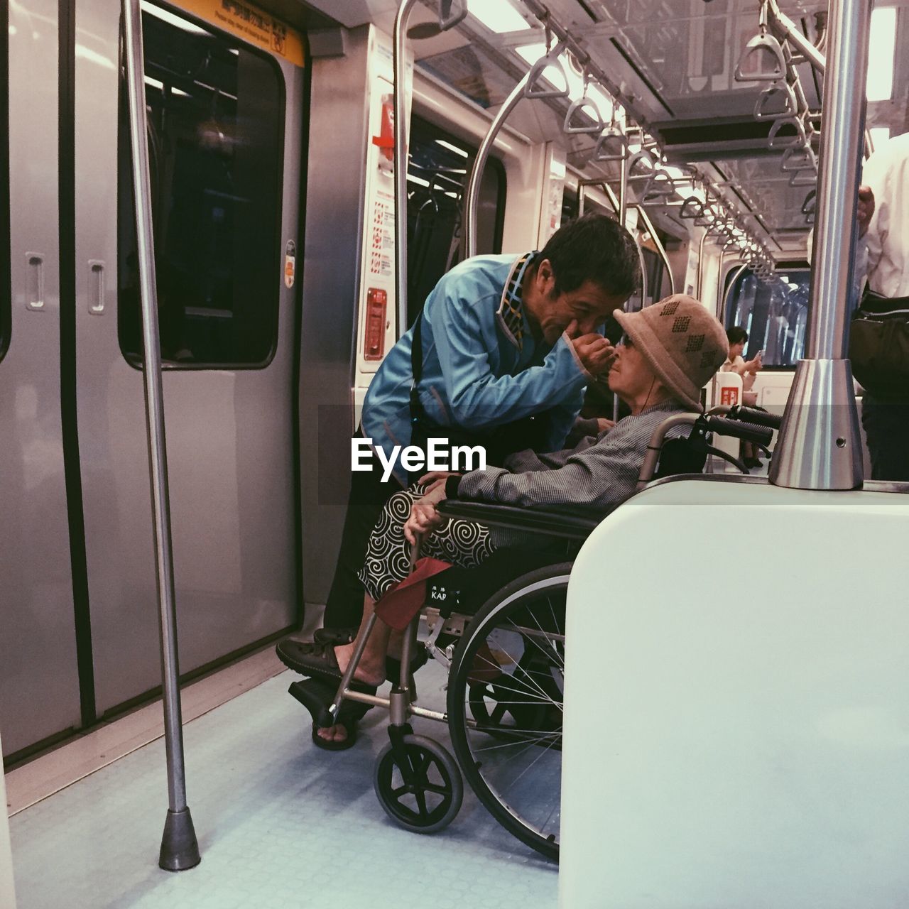 PEOPLE SITTING IN TRAIN AT BUS