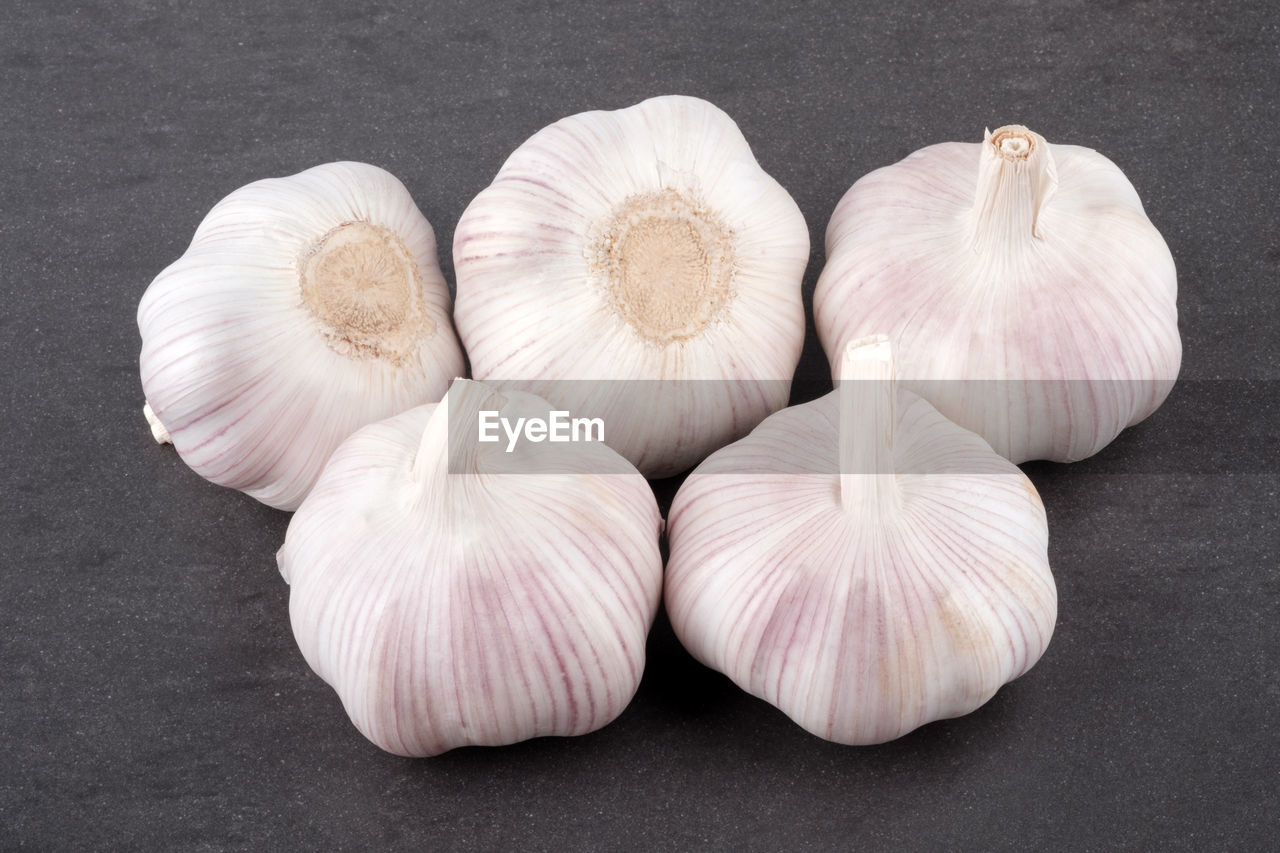 Fresh garlic on stone table