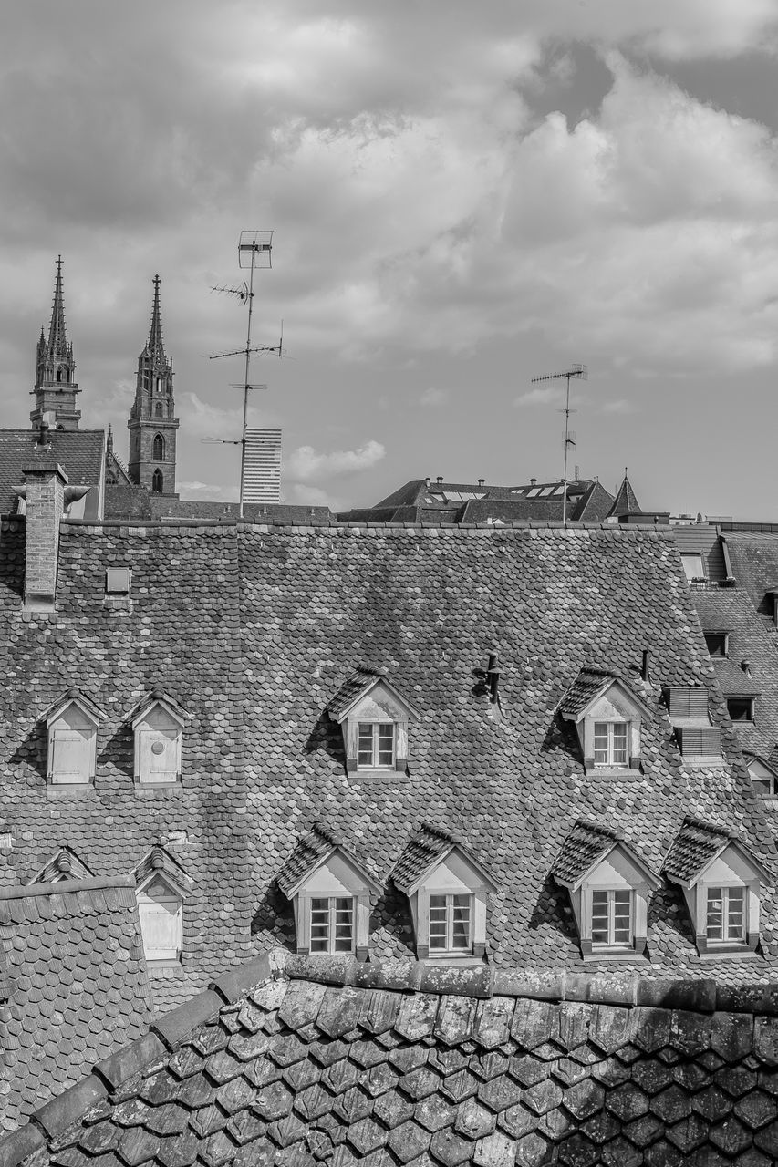 RESIDENTIAL BUILDINGS AGAINST CLOUDY SKY