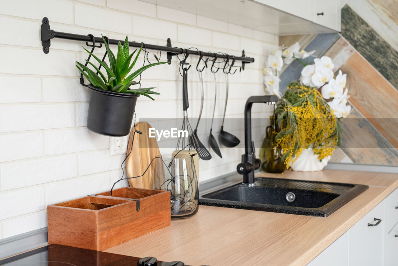 Interior of kitchen in rustic style with vintage kitchen ware and wooden wall