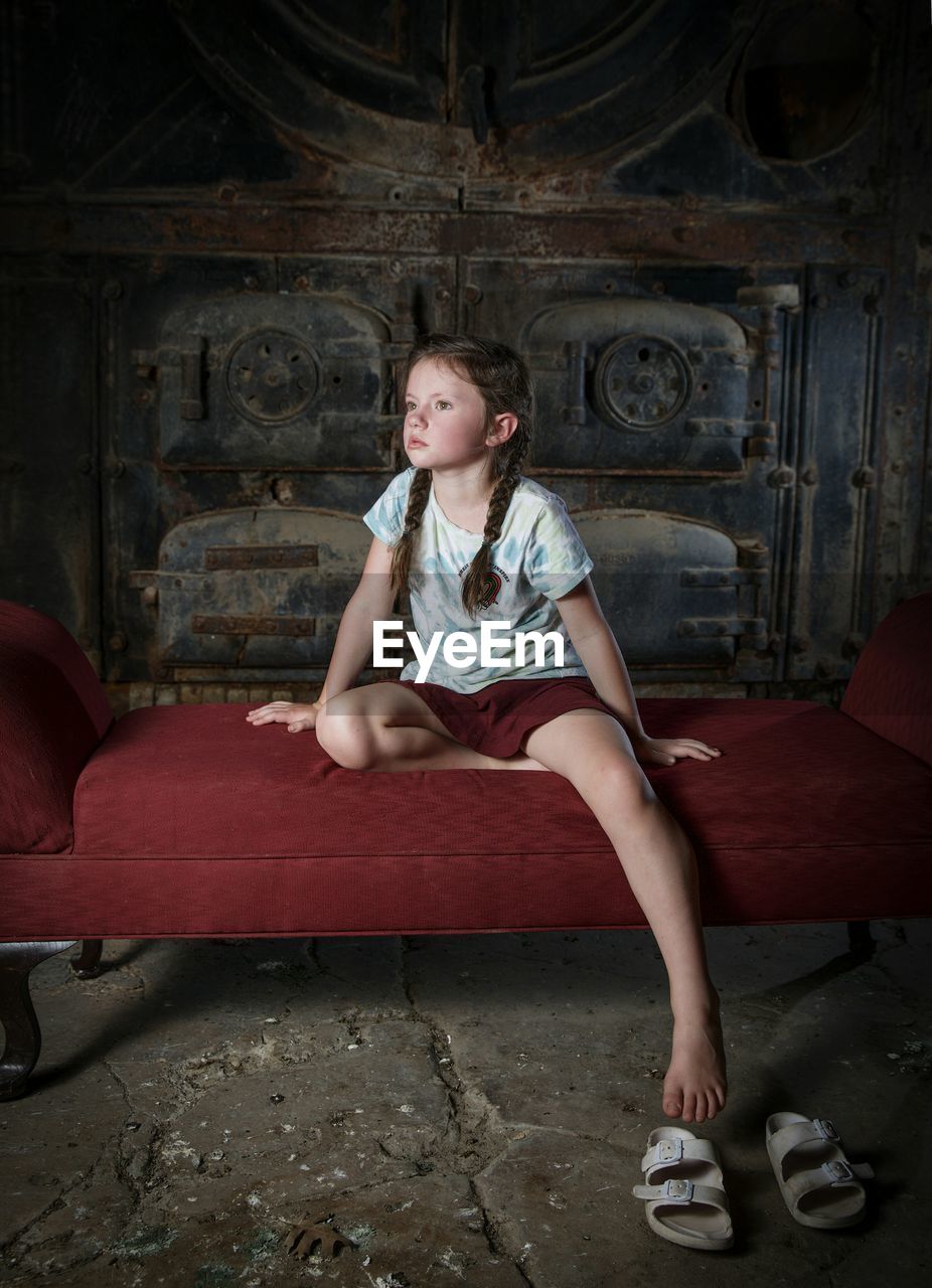 Girl sitting on bed