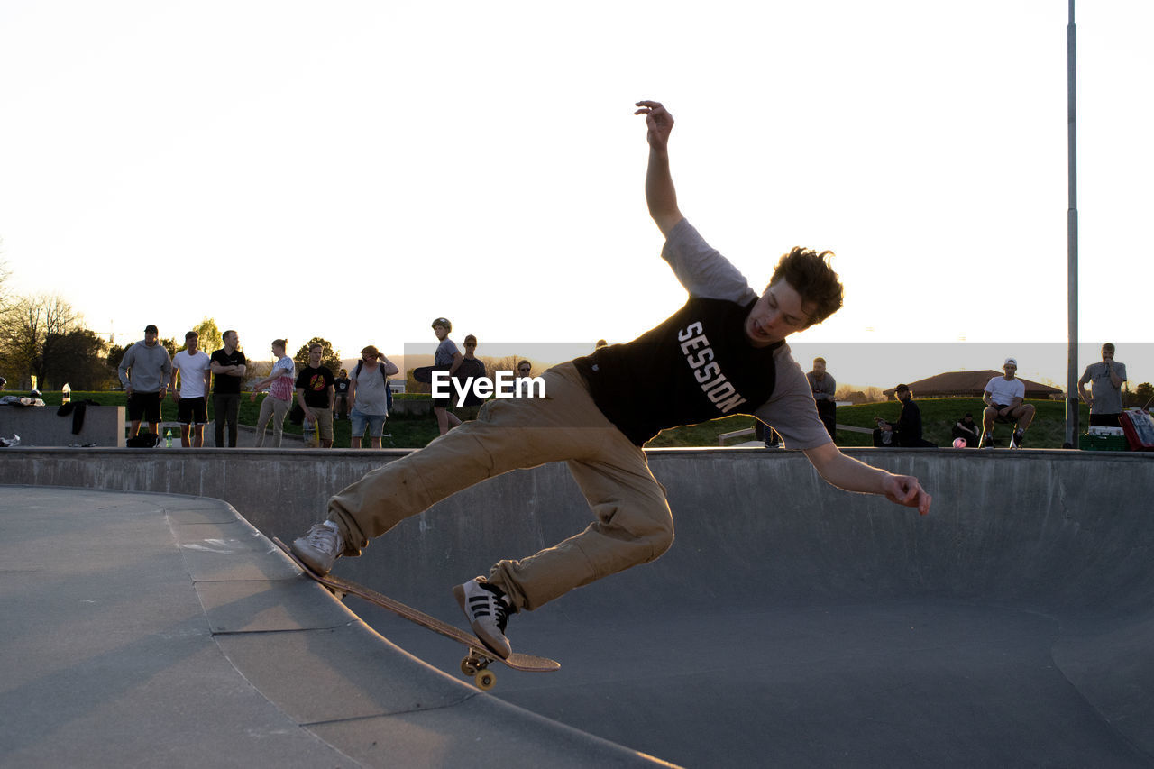 LOW SECTION OF MAN SKATEBOARDING