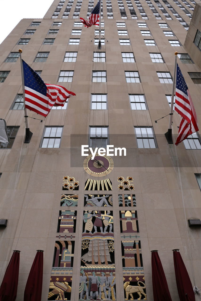 LOW ANGLE VIEW OF FLAGS ON BUILDING