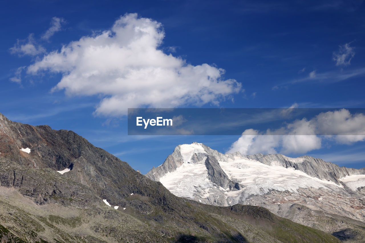 panoramic view of snowcapped mountains against sky