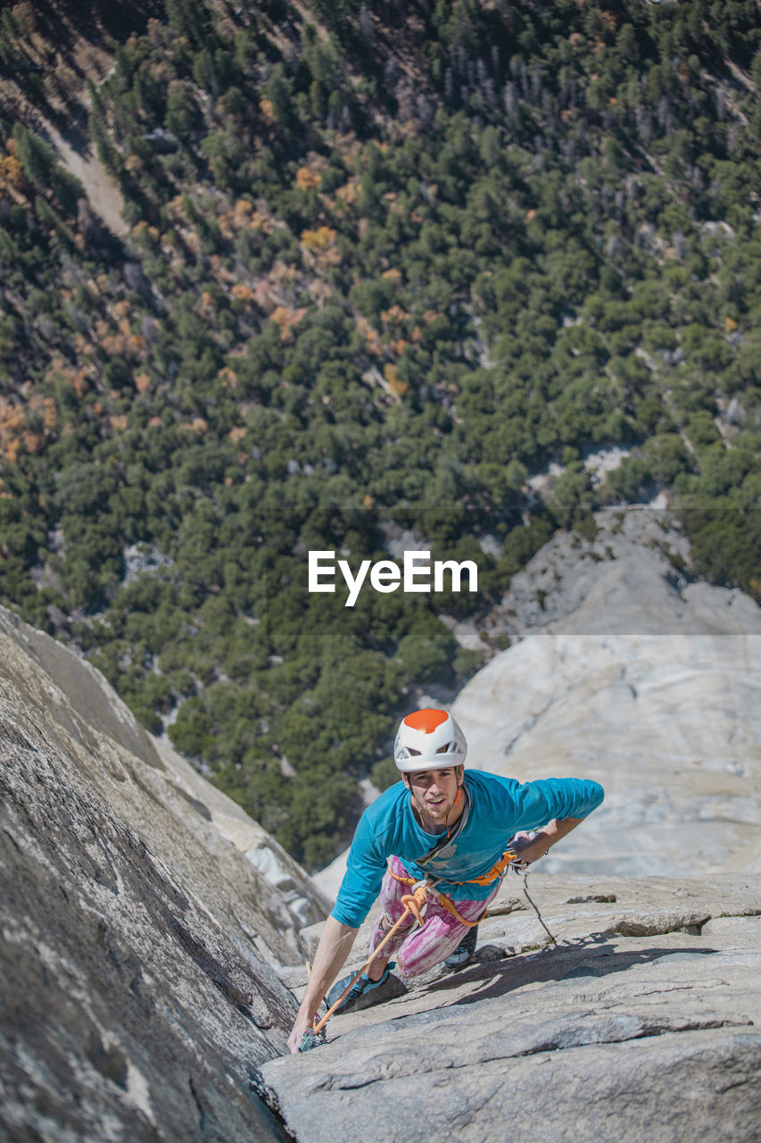 Rock climber climbing at top of el capitan very exposed on the nose