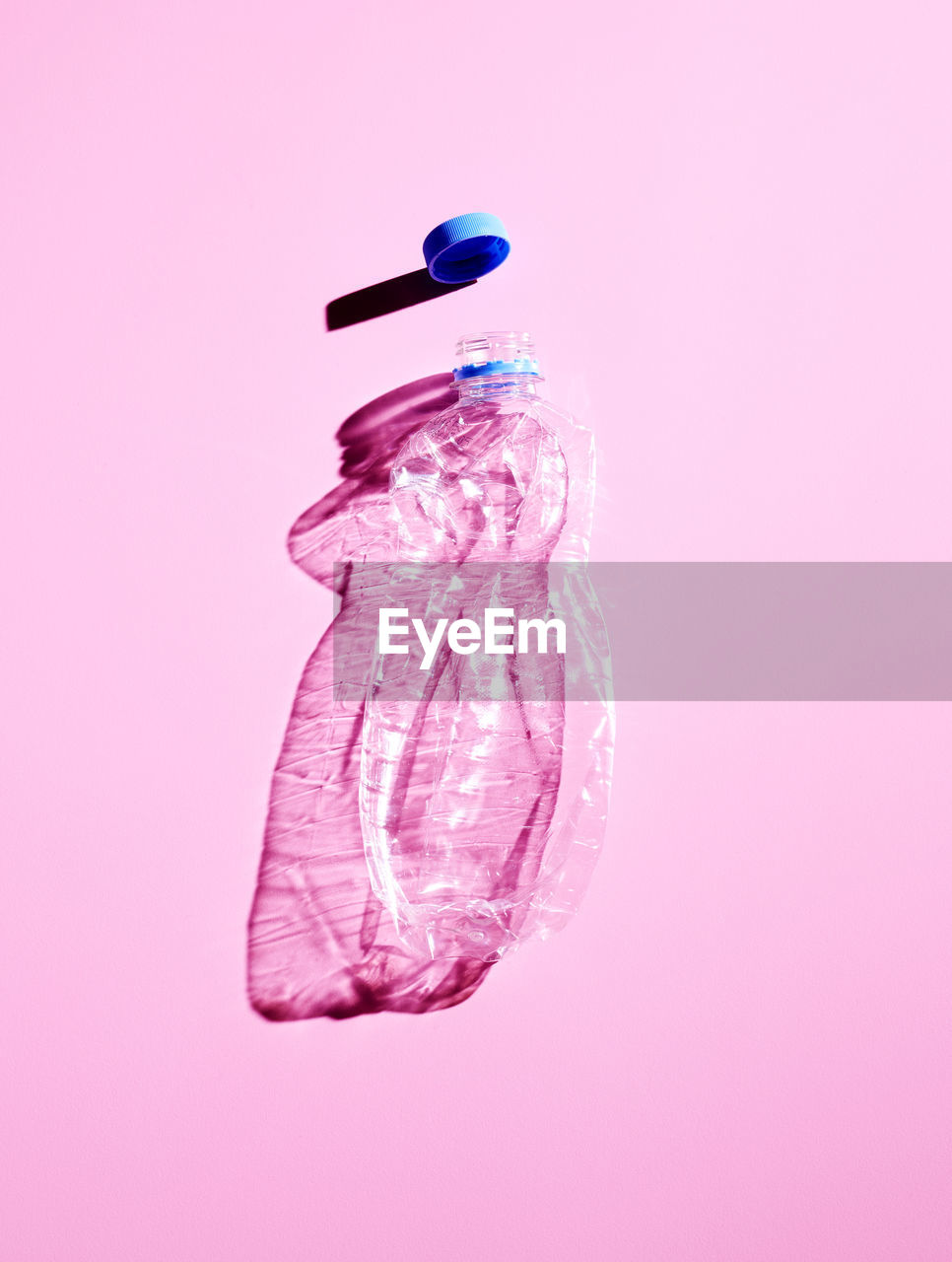 Plastic bottle on pink background