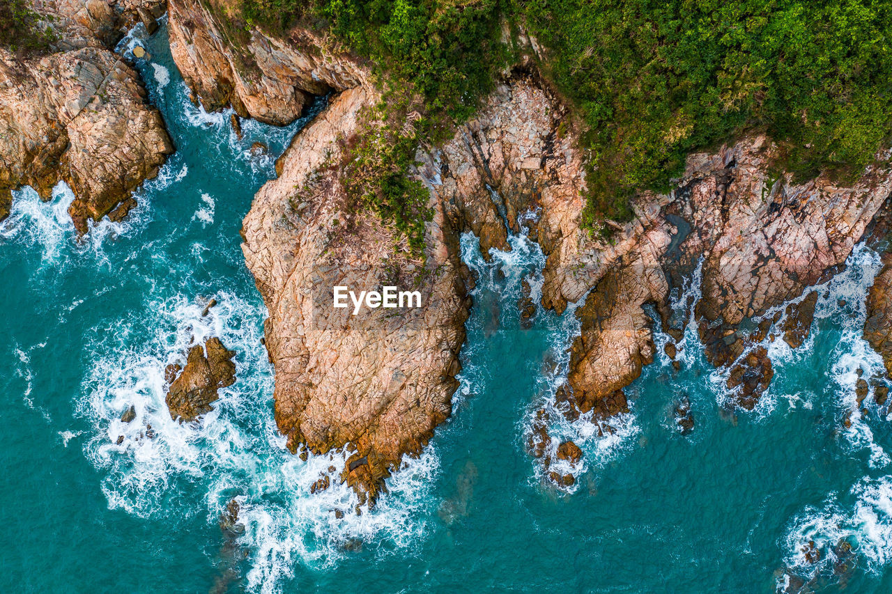 High angle view of rock formation in sea