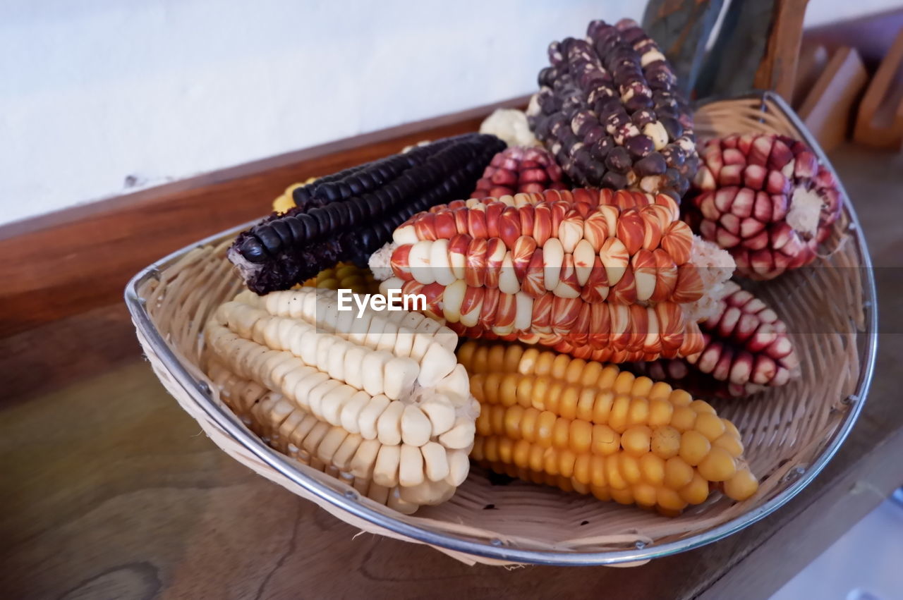 Close-up of corns in basket on table