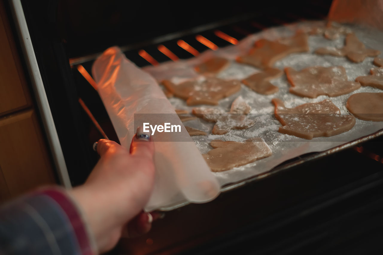 Cropped hand of person preparing food