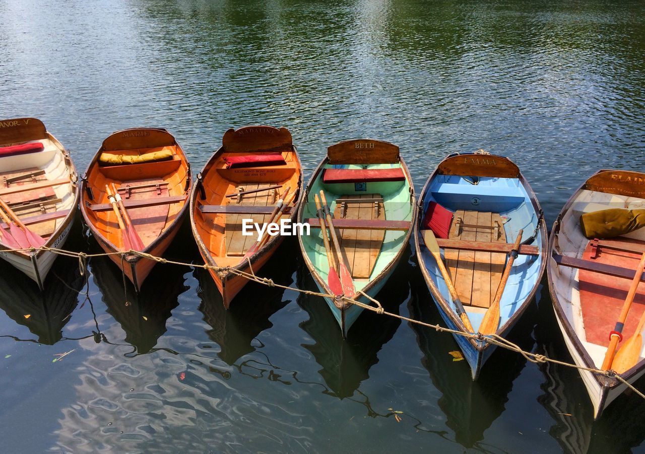 Boat moored side by side on lake