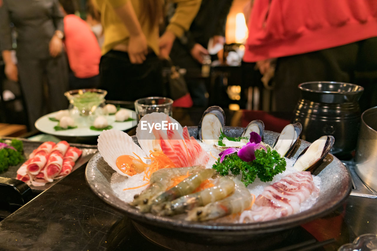 CLOSE-UP OF FISH SERVED IN RESTAURANT