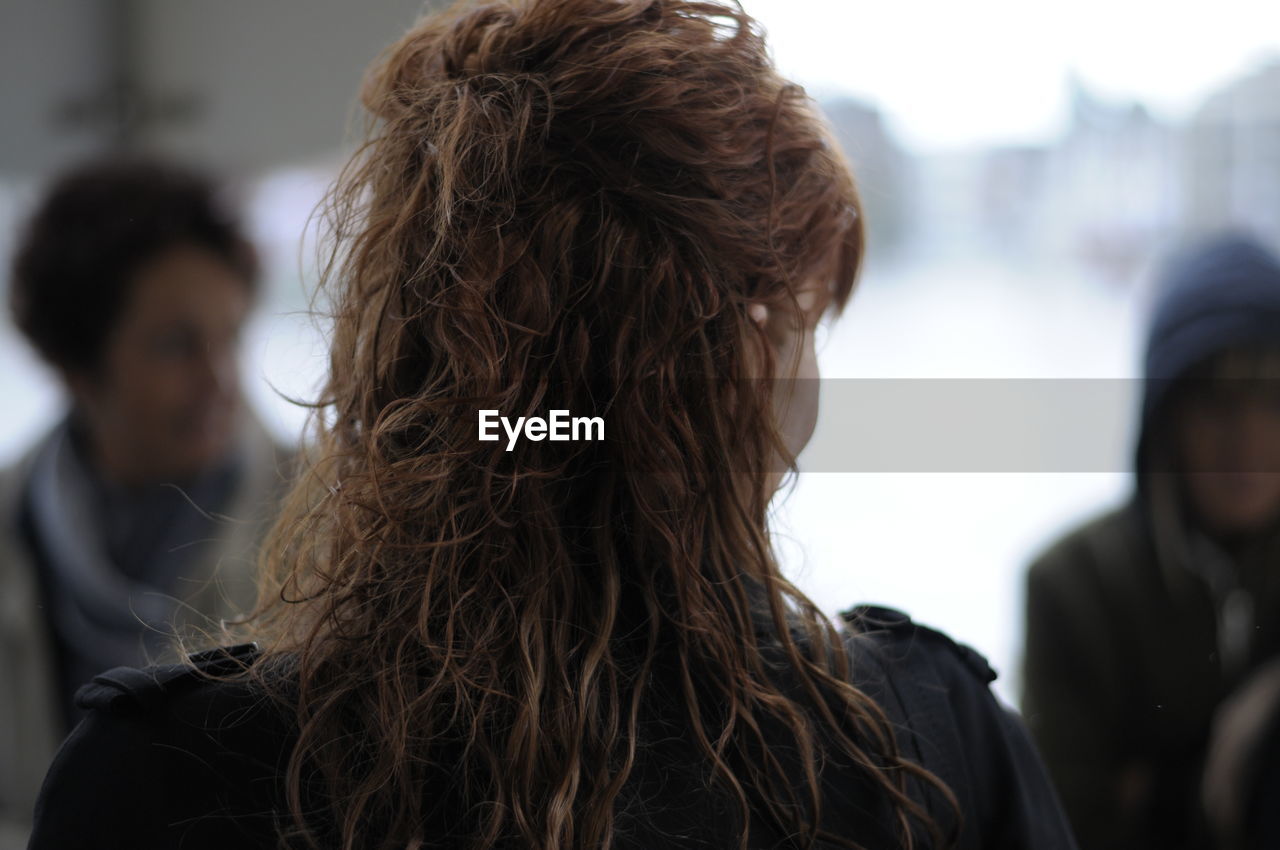 Rear view of woman with wavy hair
