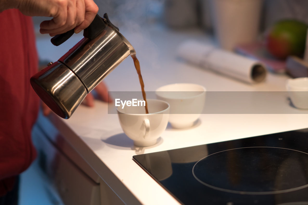 Wake up, pouring coffee from a moka pot