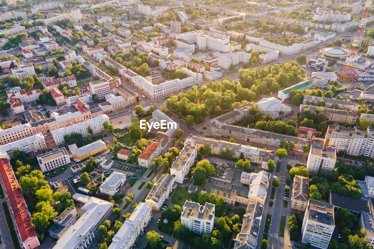 Cityscape of gomel, belarus. aerial view of town architecture. city streets at sunset, bird eye view