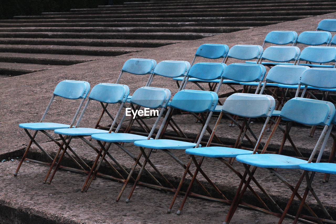 Blue chairs in princes street garden.