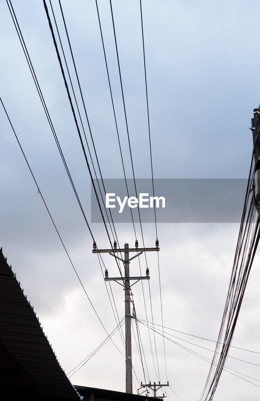 LOW ANGLE VIEW OF POWER LINES AGAINST SKY