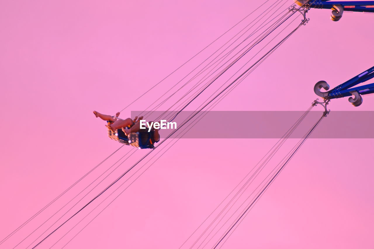 LOW ANGLE VIEW OF CABLES AGAINST PINK SKY