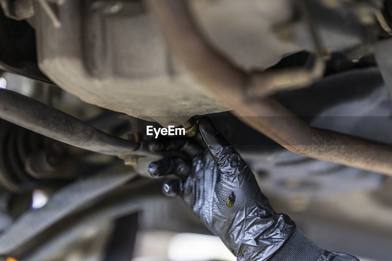 cropped image of man repairing vehicle