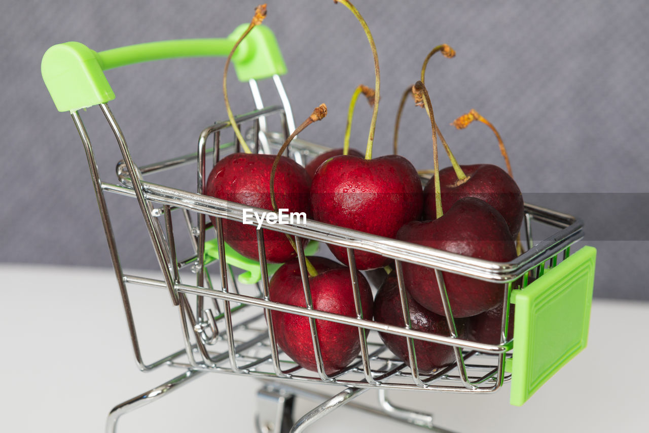 CLOSE-UP OF FRUITS IN BASKET