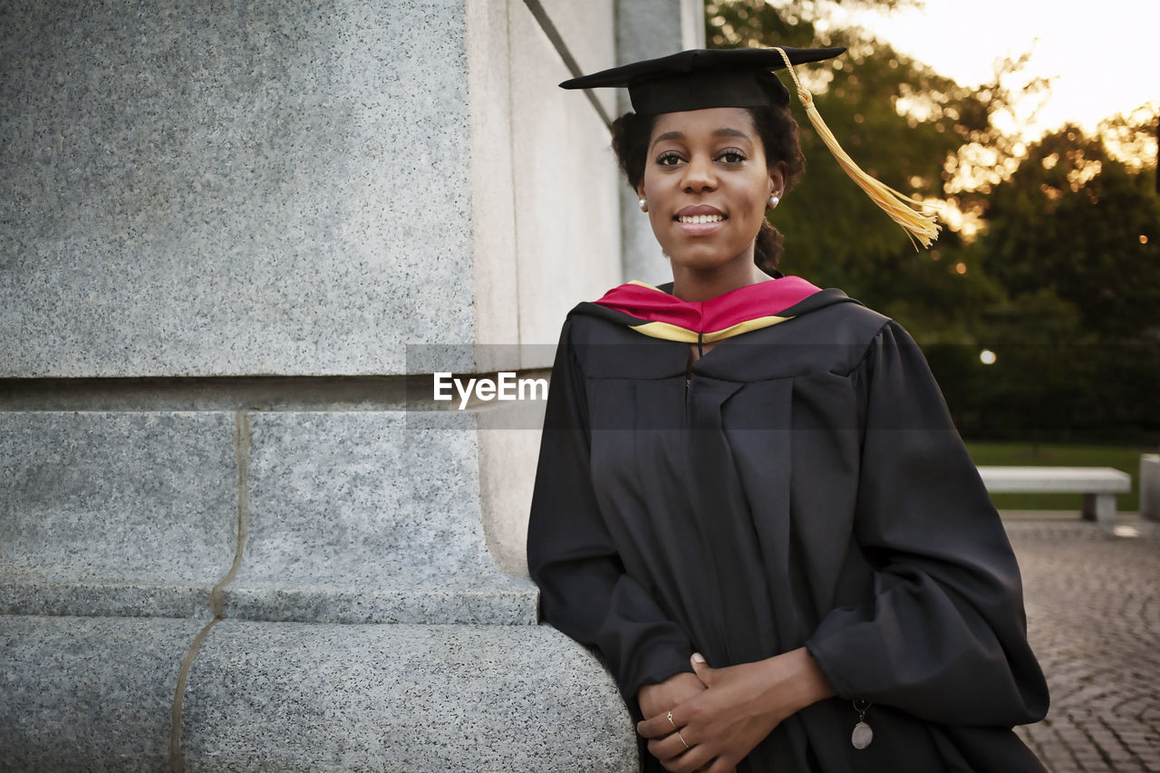 Portrait of woman wearing graduation gown