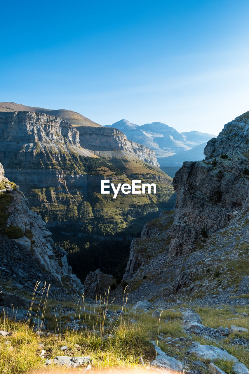 Scenic view of rocky mountains against sky