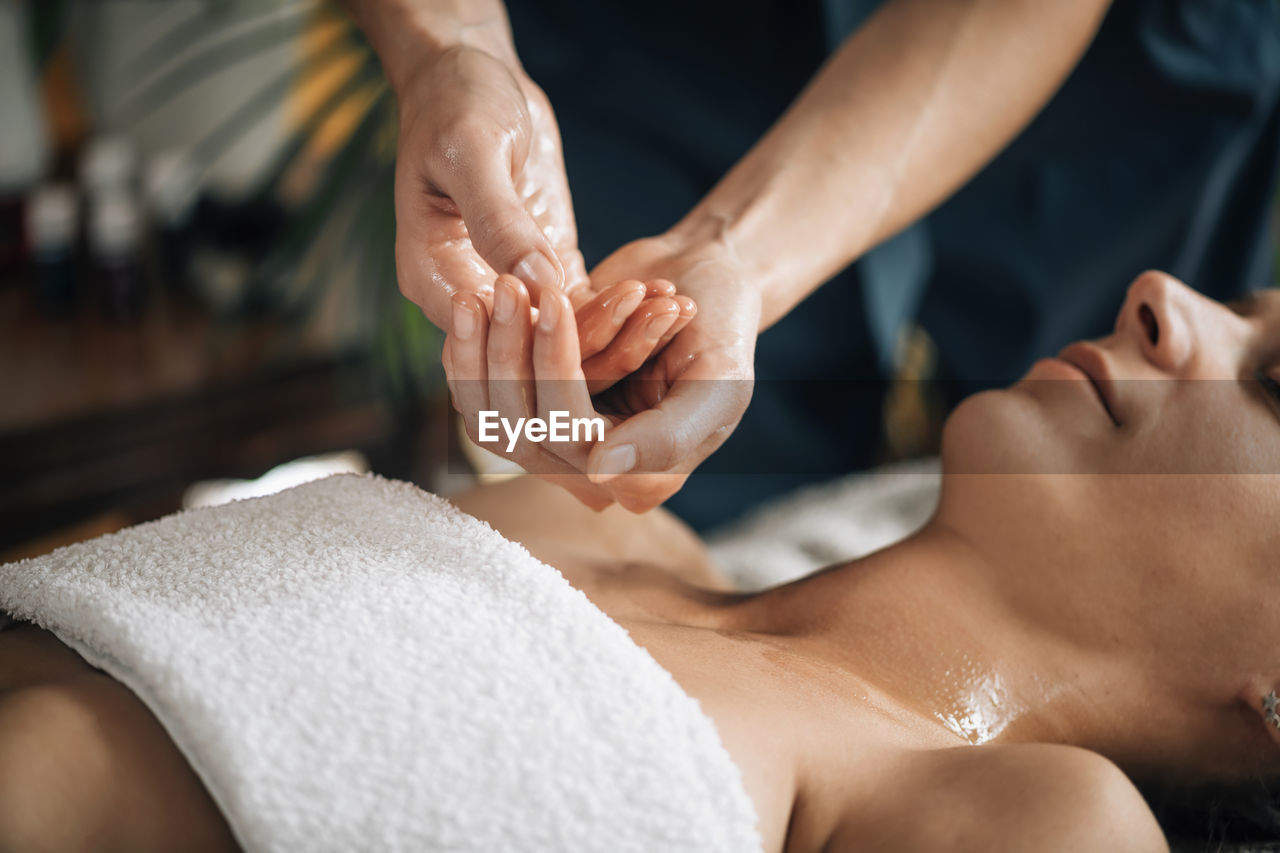 Ayurvedic aromatherapy oil massage. masseuse holding ayurveda oil for body massage