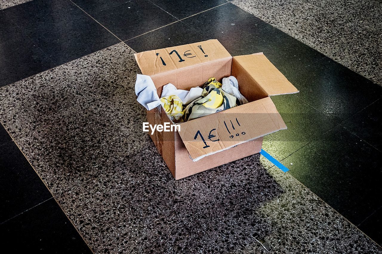 High angle view of cardboard box on railroad station