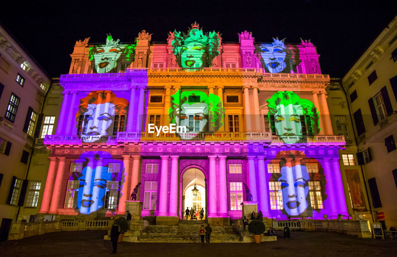 LOW ANGLE VIEW OF ILLUMINATED BUILDING