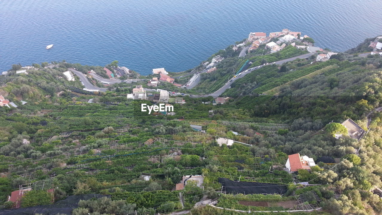 High angle view of townscape by sea