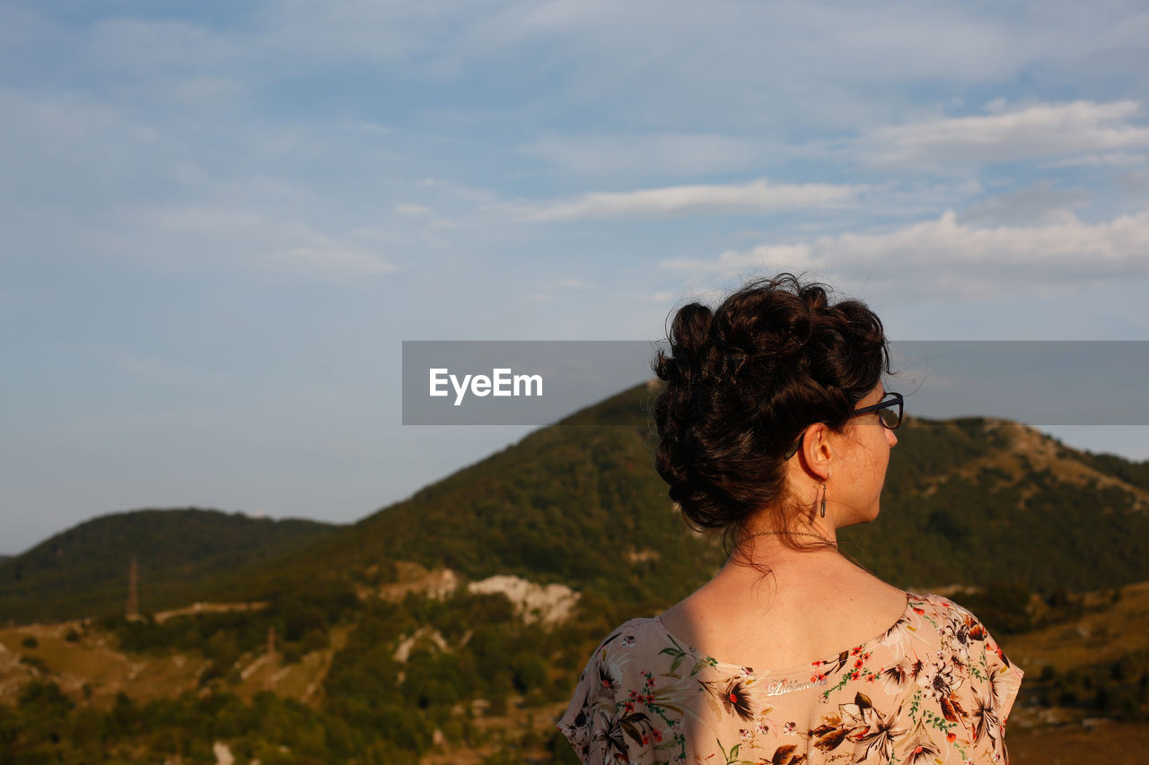 A woman watches the sunset in croatia