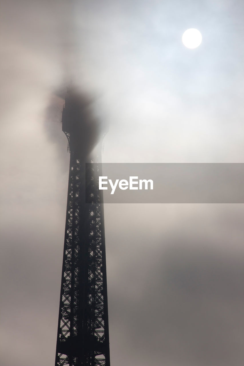 LOW ANGLE VIEW OF TOWER AGAINST CLOUDY SKY