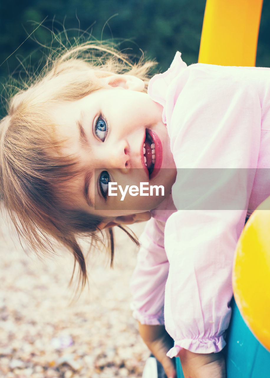 Close-up of cute girl playing at park