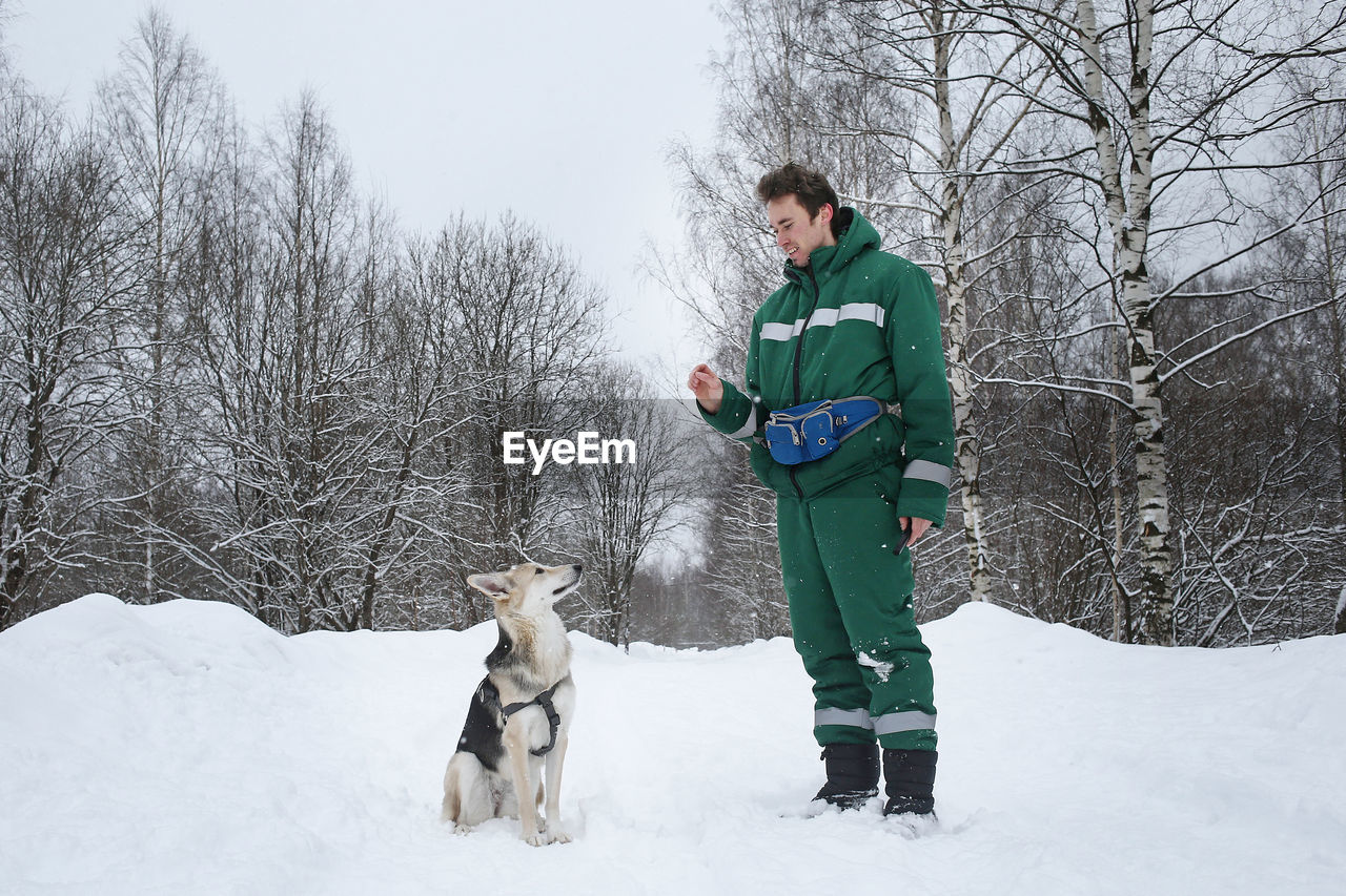 FULL LENGTH OF A DOG ON SNOW