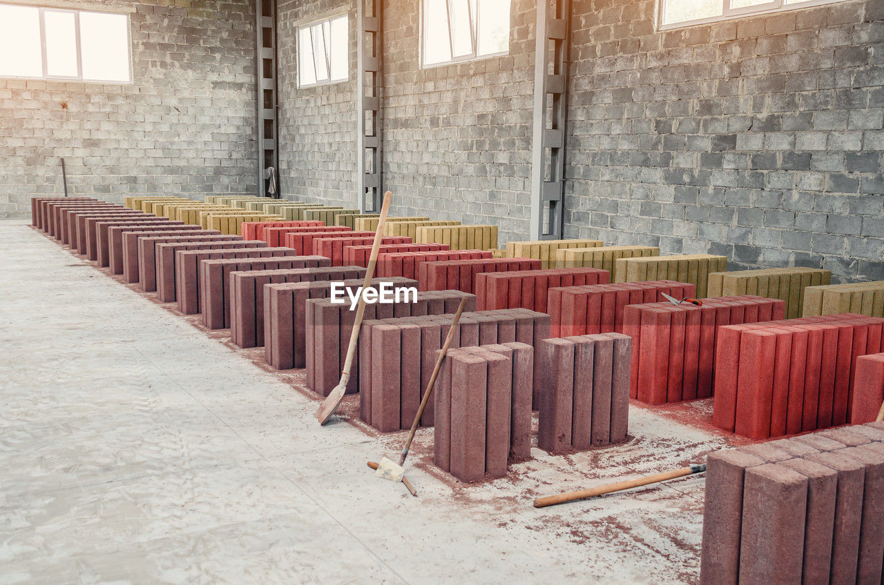 Drying of finished paving stones at factory. concrete palisades. colored paving stones