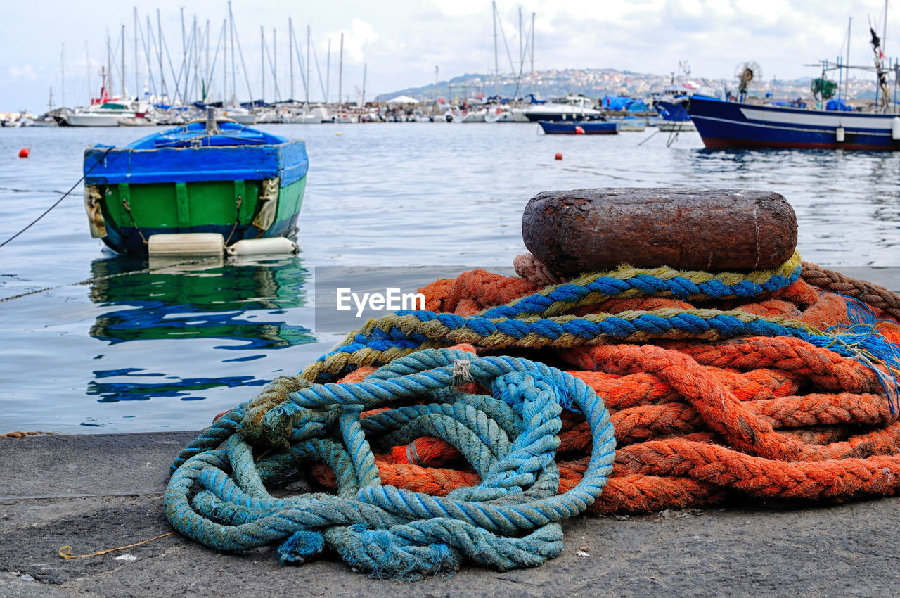 Ropes and boats at harbor