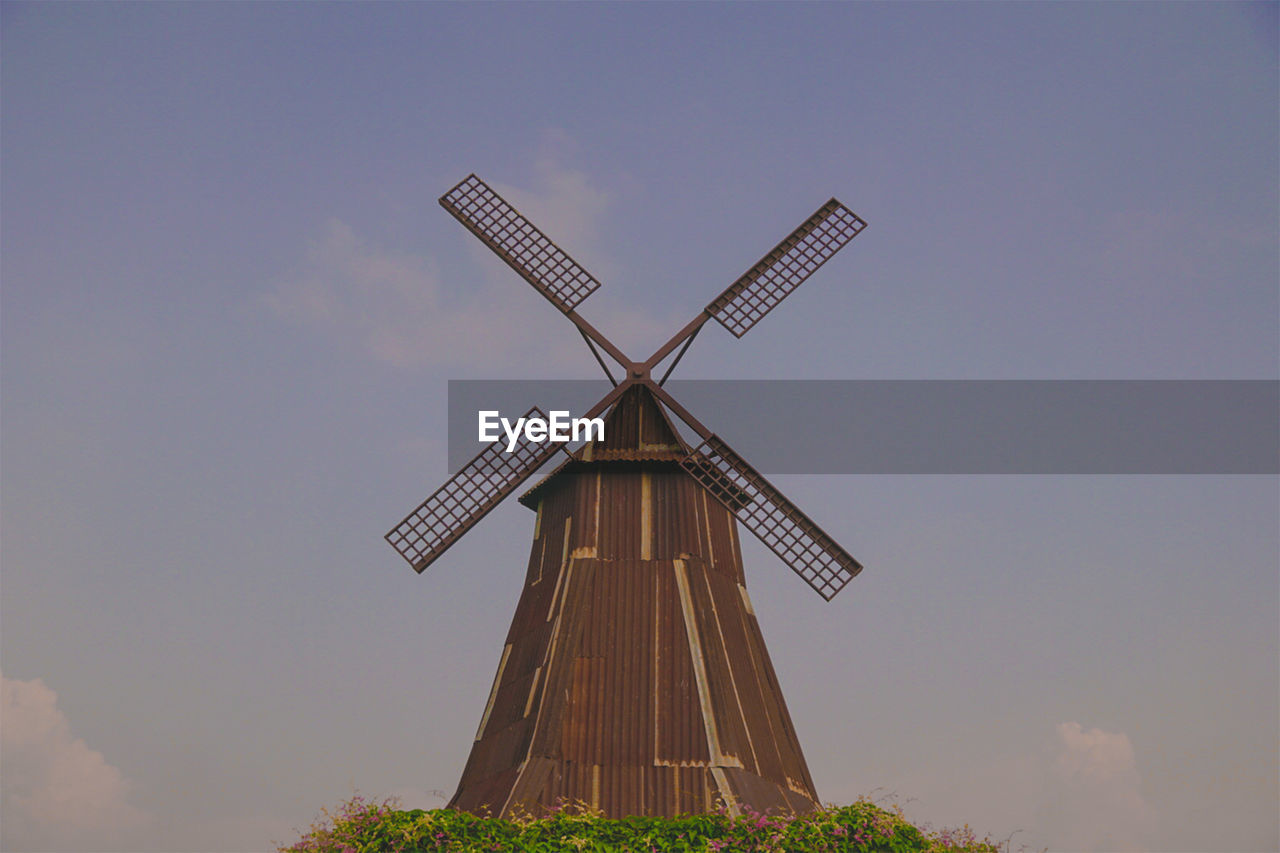 LOW ANGLE VIEW OF TRADITIONAL WINDMILL AGAINST SKY