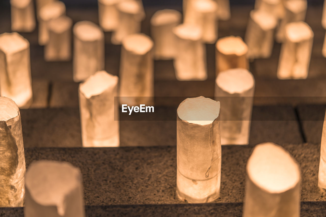 Handmade japanese paper washi lanterns illuminating the stone steps of the zojoji temple.