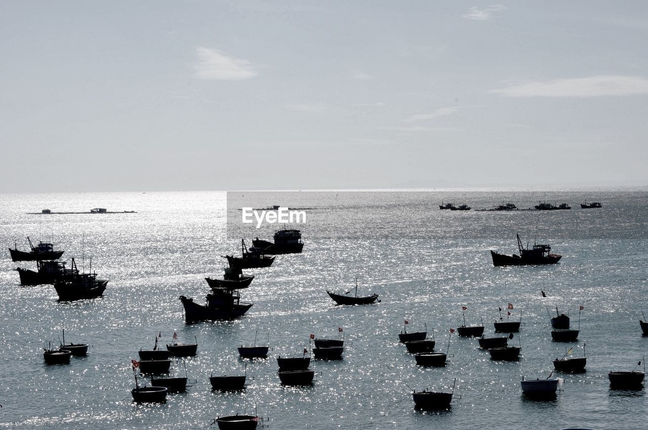 Boats moored in sea