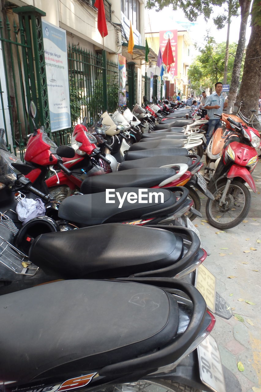 Motorcycles parked in row on street