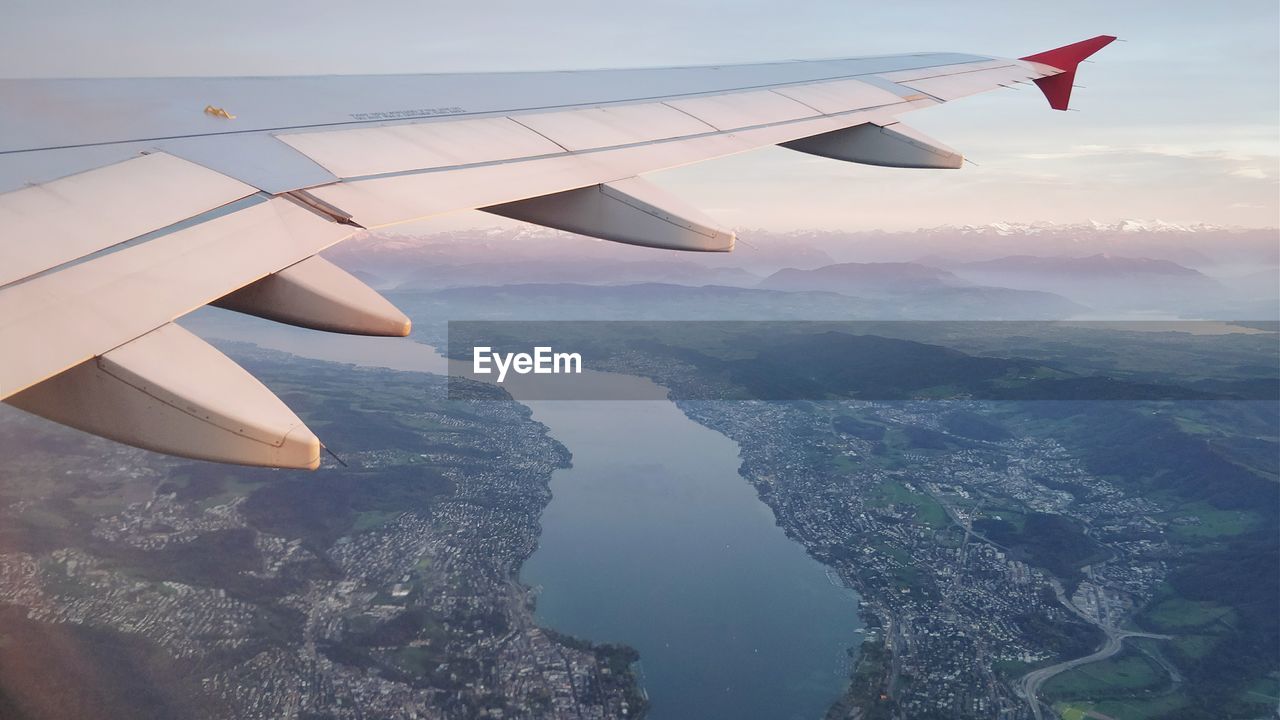 Aerial view of airplane wing over landscape