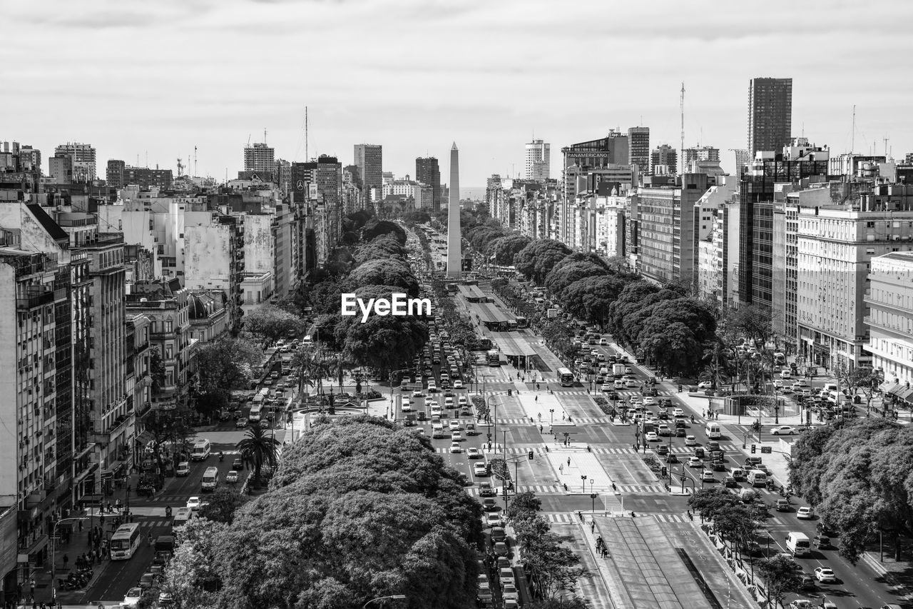 Panoramic view of city against cloudy sky