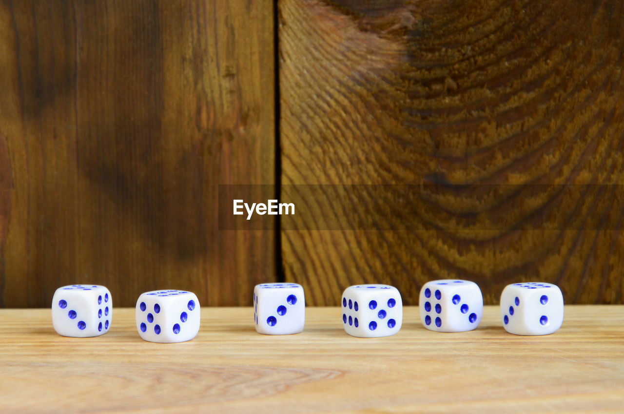 High angle view of multi colored dice on table