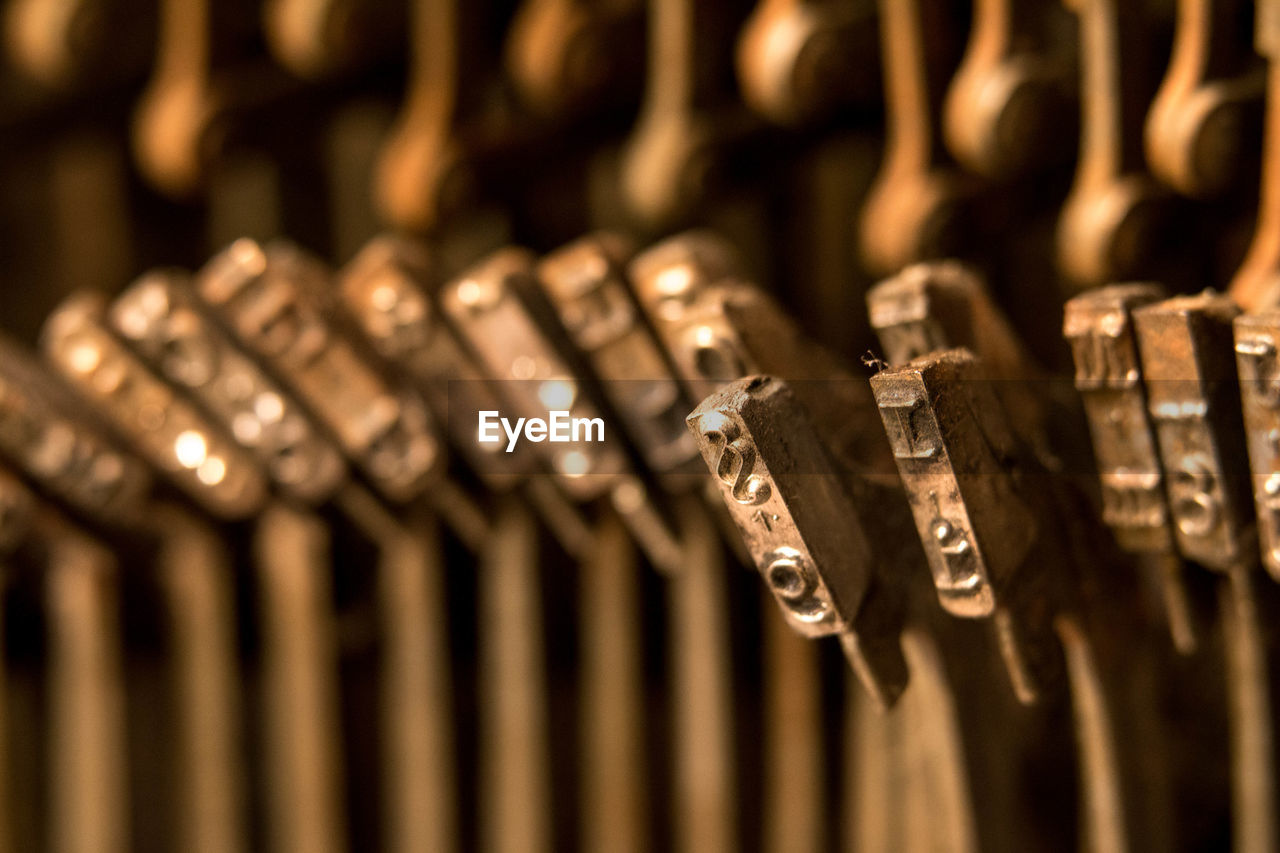 Close-up of alphabets on antique typewriter