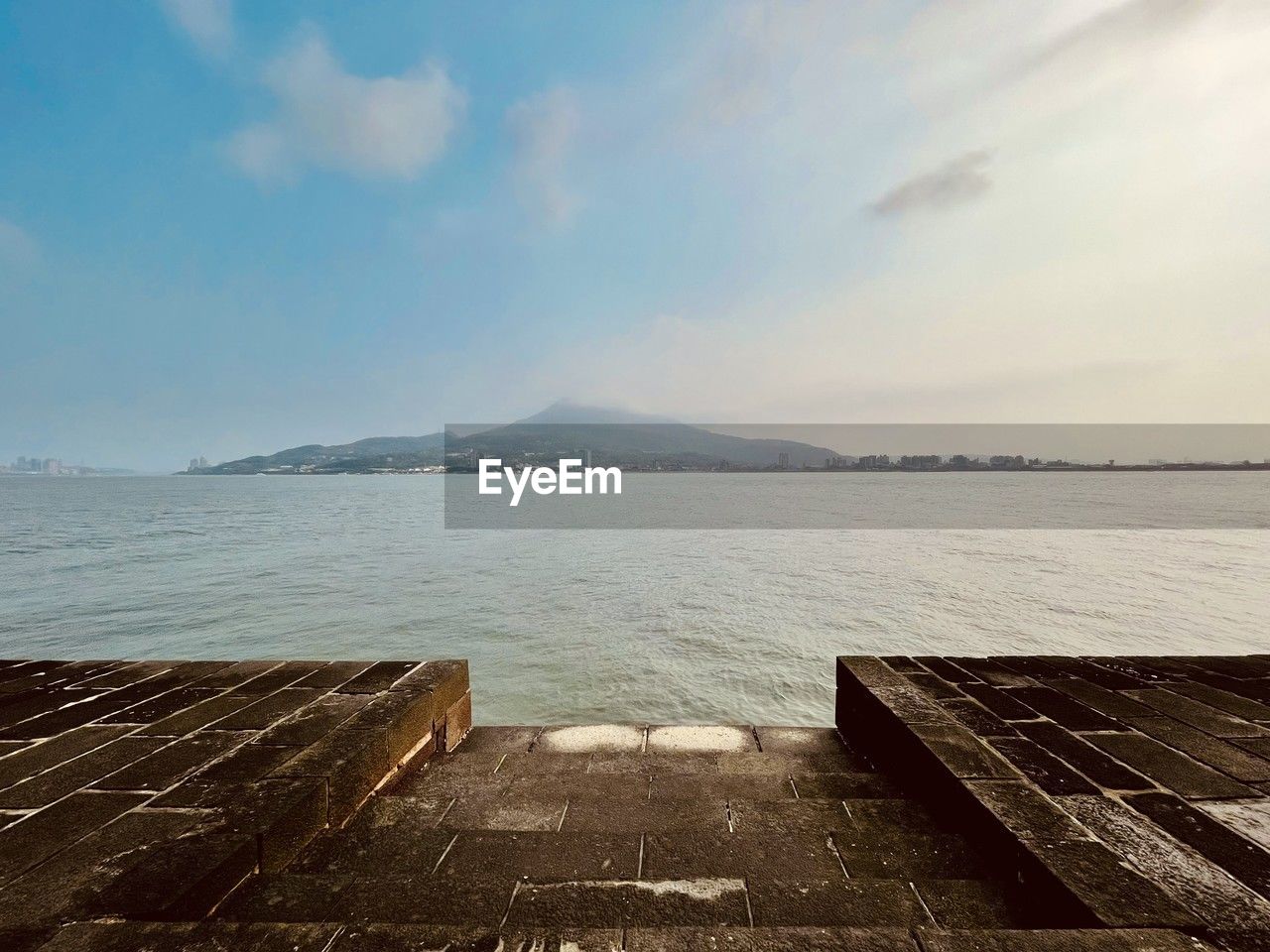 sky, water, sea, horizon, ocean, coast, shore, cloud, scenics - nature, nature, beauty in nature, land, morning, tranquility, beach, tranquil scene, environment, sunlight, body of water, no people, pier, travel destinations, landscape, outdoors, bay, day, travel, architecture, wood, dusk, wave, mountain, reflection, tourism, seascape, idyllic, coastline, sand, non-urban scene, horizon over water, vacation