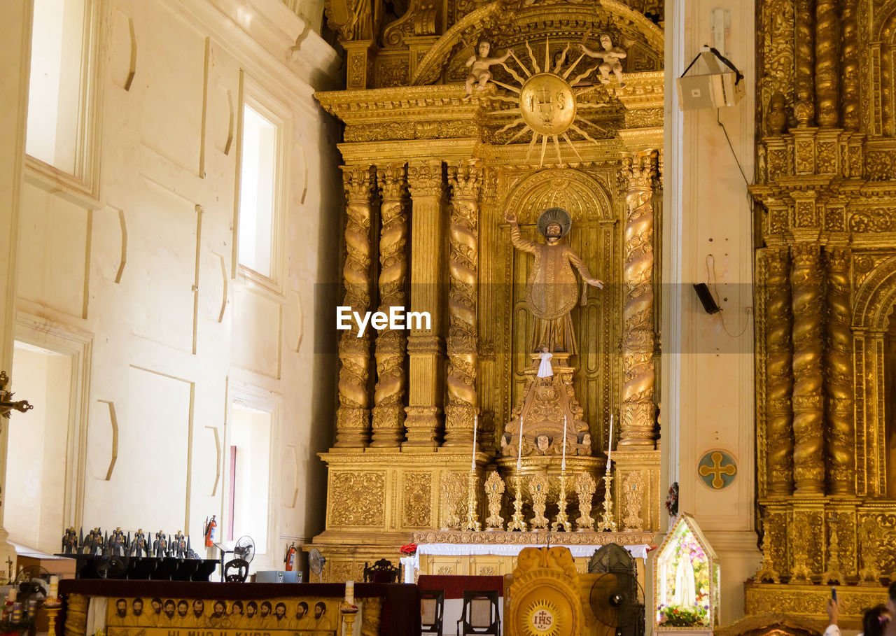 architecture, built structure, religion, place of worship, building, belief, travel destinations, spirituality, indoors, the past, history, worship, statue, travel, altar, tourism, craft, group of people, gold, sculpture, ornate