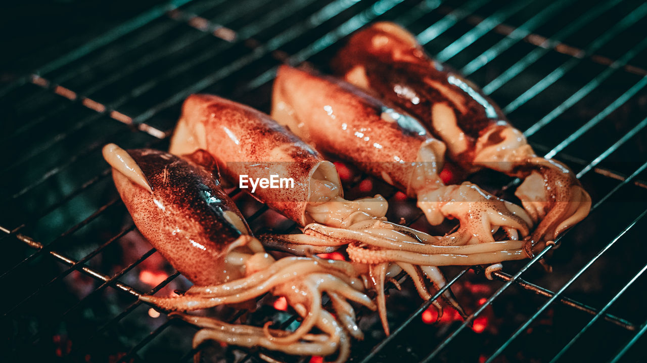 High angle view of meat on barbecue grill