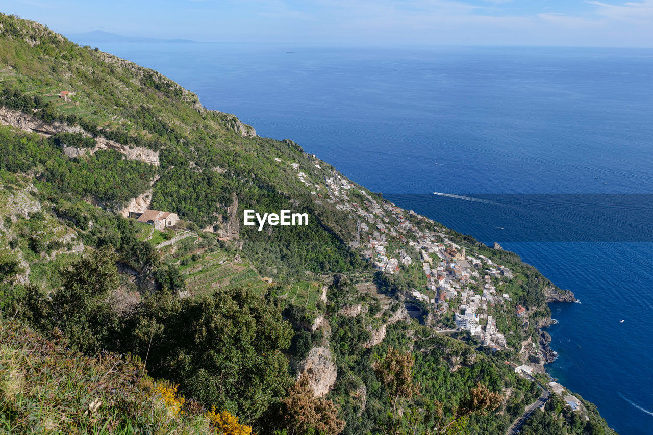 sea, water, coast, scenics - nature, land, beauty in nature, cliff, nature, high angle view, plant, beach, aerial photography, tranquility, sky, horizon over water, tranquil scene, coastline, no people, terrain, day, mountain, tree, architecture, environment, outdoors, horizon, idyllic, promontory, blue, bay, non-urban scene, landscape, ocean, travel, travel destinations, built structure, building exterior, shore, tourism, growth, aerial view, building, ridge, mountain range